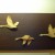 Flying Swans wooden hanging in Gamla Linkoping woodcraft shop