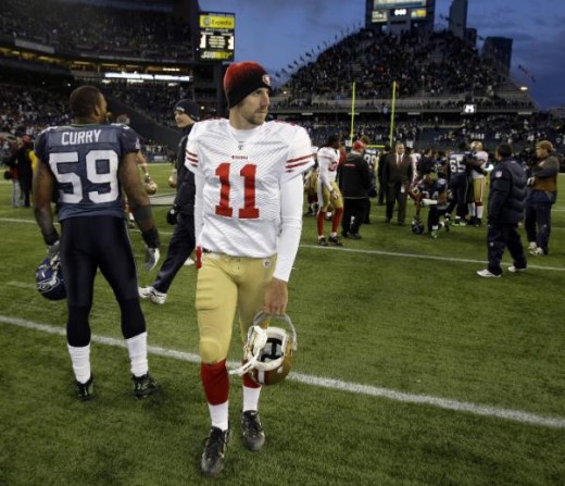 Alex Smith walks off the field after the Seattle Seahawks beat the 49ers 20-17 in an NFL football game, Sunday, Dec. 6, 2009, in Seattle. (AP Photo/Ted S. Warren)