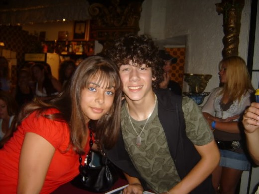 This is a photo of my daughter with Nick Jonas of The Jonas Brothers.