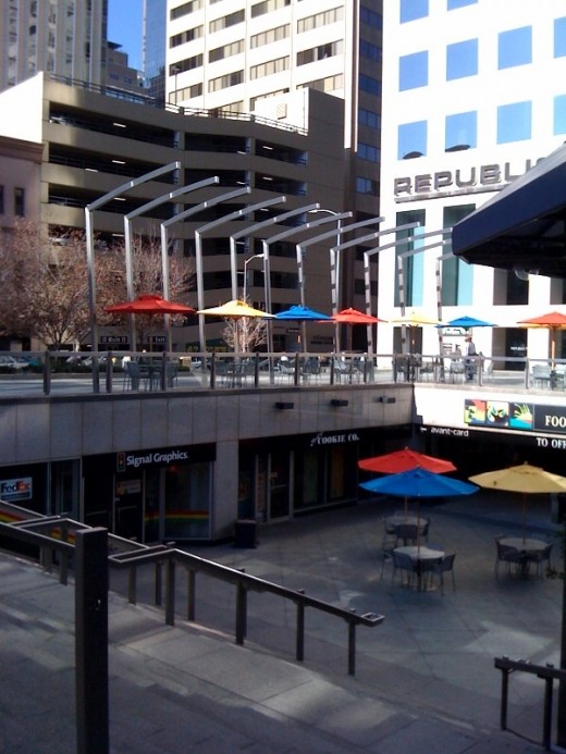 A colorful eating area outside an office building.