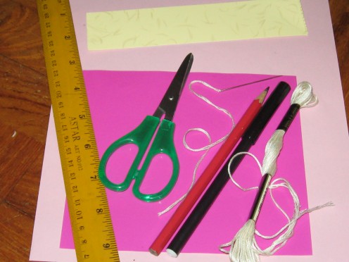 Ruler,scissors,string,pencil,marker,pink and cream color paper, pink manilla card