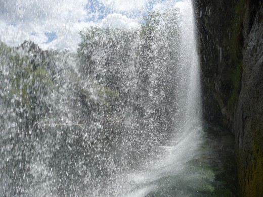 Behind the waterfall