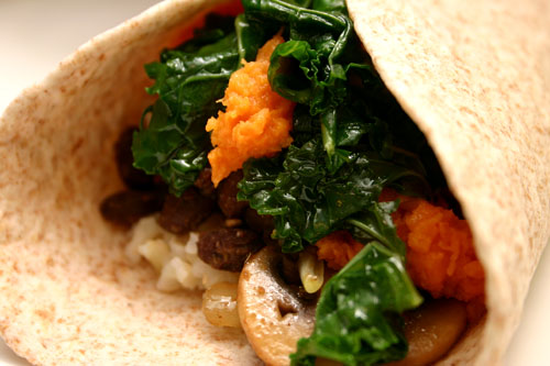 vegetarian sweet potato black bean burrito with kale, mushrooms, and rice