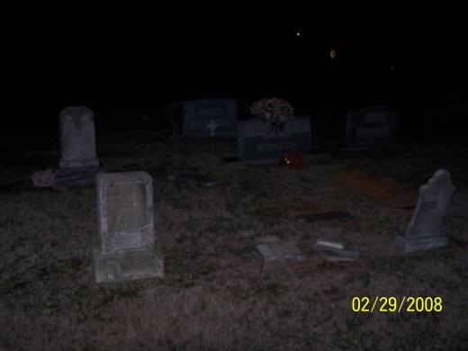 See the cross in the back of the photo in the center. At night it glows with a bright white light even though it was never fixed to do so. 