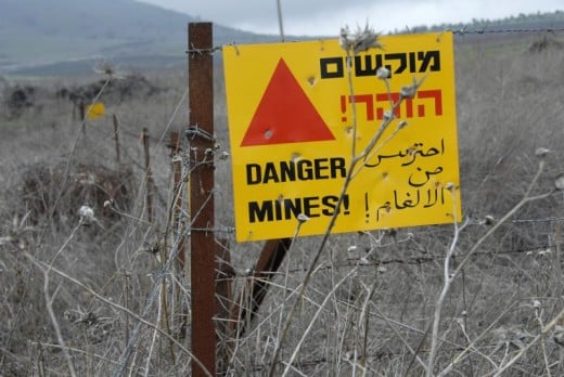 Minefields are still a danger many years after the war. Israel claims Syria left the bombs; Syria claims Israel did. You can see the Sea of Galilee in the background.