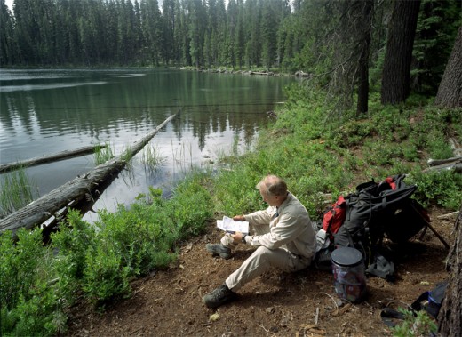 Bill checks his guide book next to Heavenly Twin Lake.