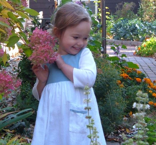 A child enjoying the flowers. What music does she hear, I wonder?