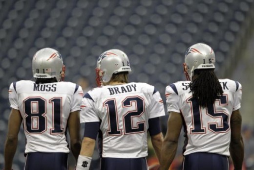 New England Patriots quarterback Tom Brady (12) and receivers Randy Moss (81) and Isaiah Stanback (15) before an NFL football game against the Houston Texans Sunday, Jan. 3, 2010 in Houston. (AP Photo/David J. Phillip)