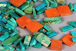 Ancestral Puebloan (Anasazi) turquoise and orange argillite inlay pieces from Chaco Canyon (dated ca. 10201140 CE) show the typical colour range and mottling of American turquoise - from wikimedia.commons
