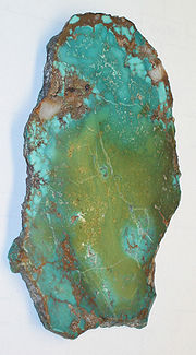 Slab turquoise in matrix showing a large variety of different coloration - wikimedia.commons