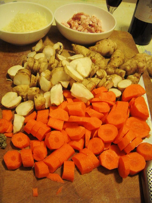 Chop carrots and artichoke roots