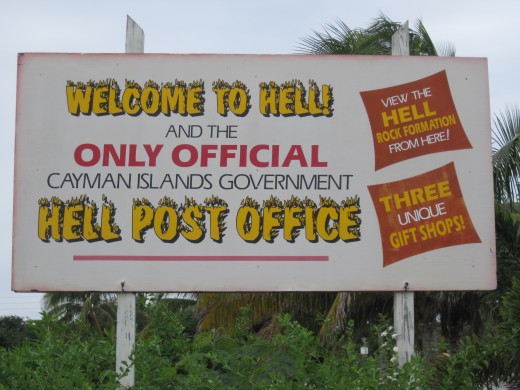 Sign in parking lot of Official Hell Government Post Office
