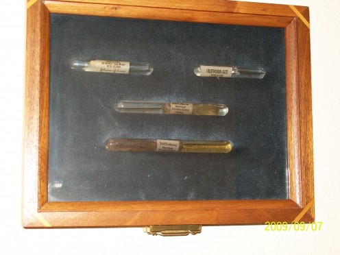 Surgical sutures in vials for sterile preservation.
