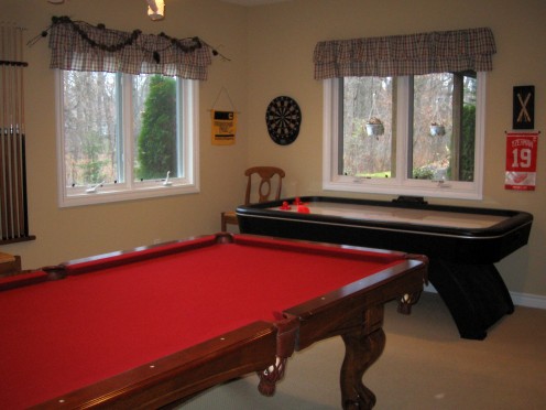 Make game room large enough to fit game tables and appropriate playing area.