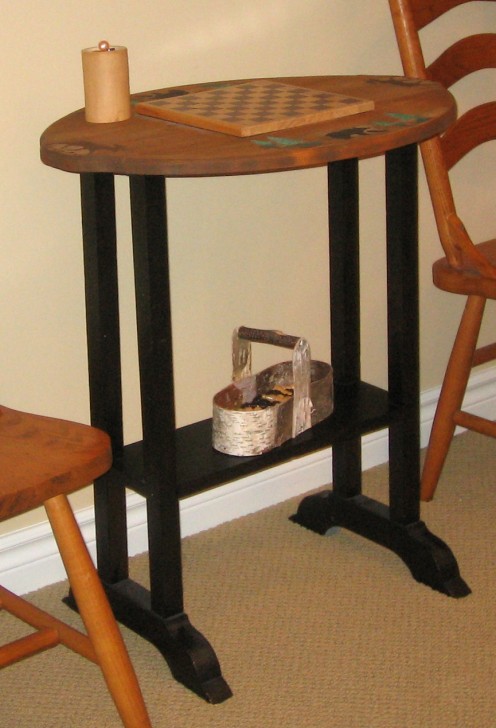 Tabletop checkerboard with gamepieces in birch basket below.