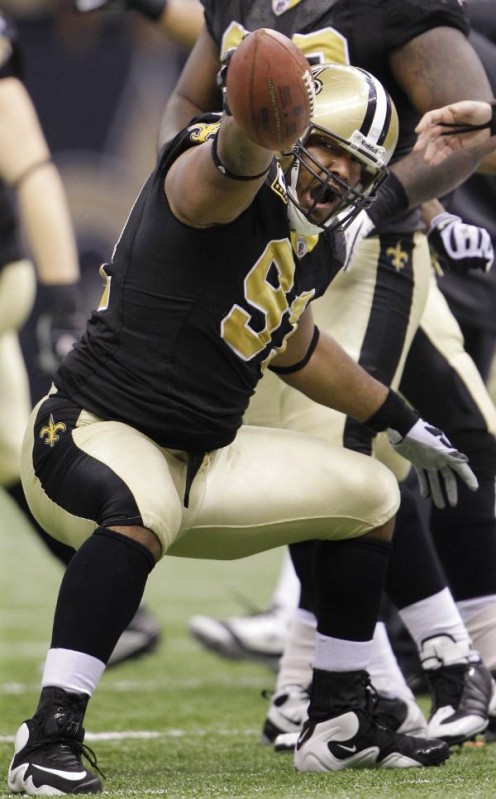 New Orleans Saints defensive end Will Smith (91) reacts after intercepting a pass from Arizona Cardinals quarterback Kurt Warner during the second quarter of an NFL football divisional playoff game in New Orleans, Saturday, Jan. 16, 2010. (AP Photo/D