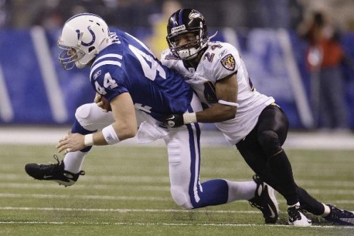 Indianapolis Colts tight end Dallas Clark is tied up be Baltimore Ravens cornerback Domonique Foxworth during the first quarter of NFL divisional football playoff game, Saturday, Jan. 16, 2010 in Indianapolis. (AP Photo/Darron Cummings)