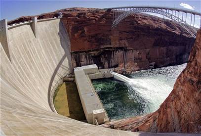 Water being released at a major force from the bottom of the Glen Canyon Dam.