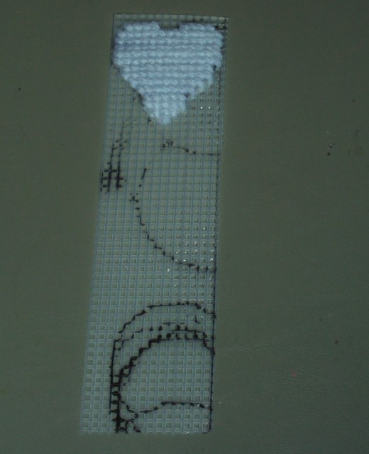 Here is the completed heart.  As you can see it begins with a separation at the top, and become fuller towards the middle.  The heart tapers towards the bottom, and is a very simple shape to cross stitch on free hand once you get used to it.  I still