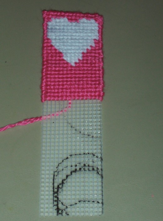 The bookmark is looks very appealing with the lustrous pink color being stitched on.