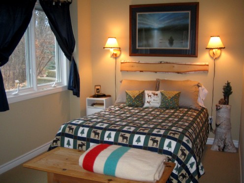Guest room bed with faux headboard. Guest room bed with faux headboard.
