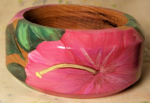 Wide wooden bangle with hibiscus flower design