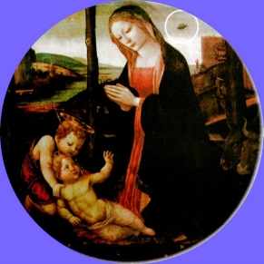 This magnificent painting is called "The Madonna with Saint Giovannino". It was painted in the 15th century. The Palazzo Vecchio lists the artist as unknown although attributed to the Lippi school. Above Mary's right shoulder is a disk shaped object.