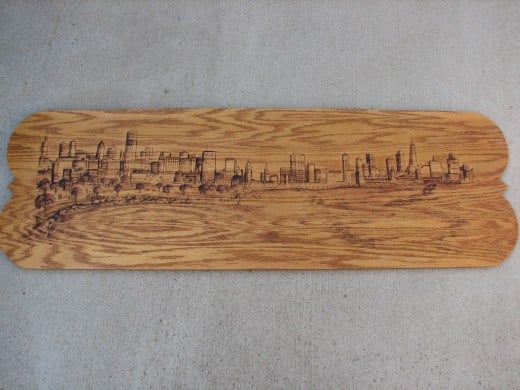 This work measures 4ft x 18in pyrographics on stained oak wood  panel