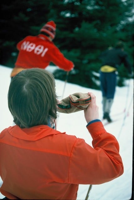 Cross country skier pausing for a drink of water during the Canadian Ski Marathon.