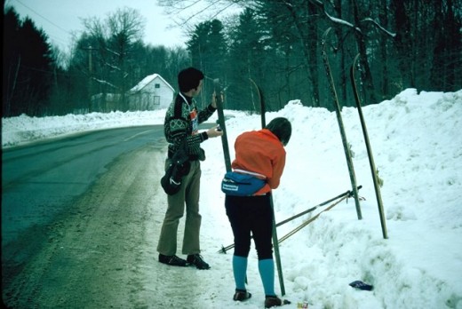 My sister and I pausing to wax our skies while competing in the Canadian Ski Marathon.