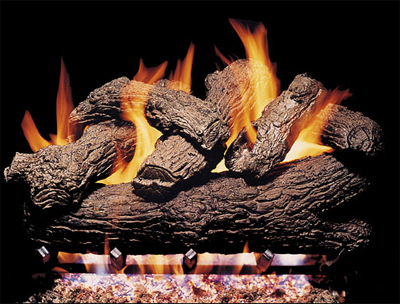 Vented gas log fireplace logs can be stacked and way that makes the best flame pattern because ventilation will pull any fumes out of the area.  Although carbon and creosote is not minimized the hand painted logs will hide discoloration from the flam