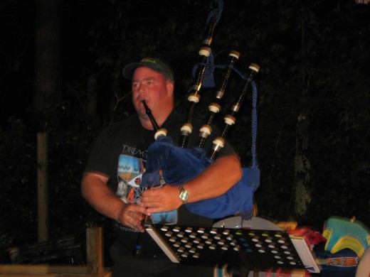 Keith playing bagpipes at a fish fry.