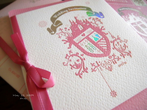 Accents like ribbons and colorful ink add personal style to wedding stationery