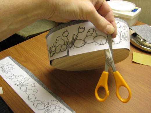 cut slits to make pleats that will allow the pattern to lay flat