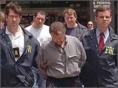 Vyacheslav Ivankov, escorted by FBI agents after arrest in 1995