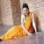 Yashoda in a yellow saree Yashoda in a yellow saree