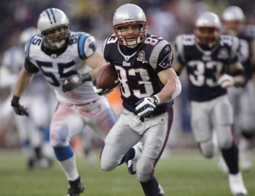 New England Patriots wide receiver Wes Welker (83) scrambles for a gain during an NFL football game in Foxborough, Mass., Sunday, Dec. 13, 2009. (AP Photo/Charles Krupa)
