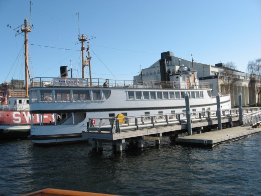 The Virginia V with a steam driven engine at the southern end of Lake Union moored in front of the Wooden Boat Center