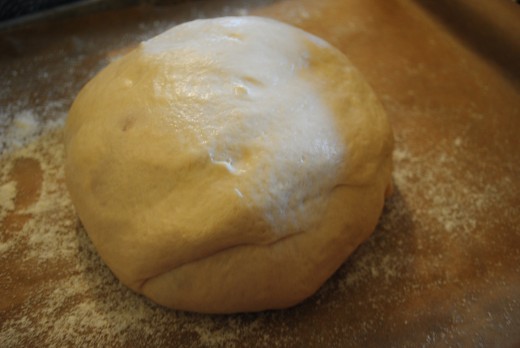 Form the dough into a ball. This classic shape is called a boule.