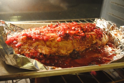 The sauce will slowly caramelize in the oven, sealing the rack.