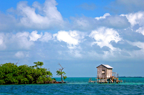 A laid back fishing shack out on the water.