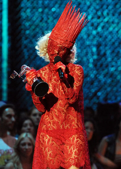 Lady Gaga wearing Alexander McQueen's red lace dress