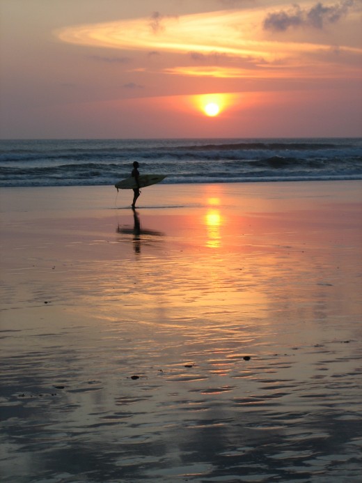 Enjoy the beautiful sunset as you walk along the beach.