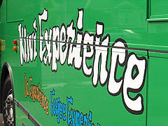 The crazy Lettering shows Promise of exciting Times to come. The bright Green is the Livery of the Kiwi Bus.