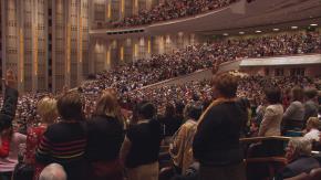 LDS Members gather in the Conference Center in SLC as well as in Church buildings and member homes around the globe, via satellite and cable transmission.