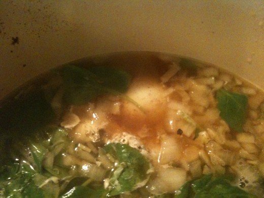 See the sneaky little white orb in the middle of the edge of the pot? That's an egg - poaching away to lusciousness.
