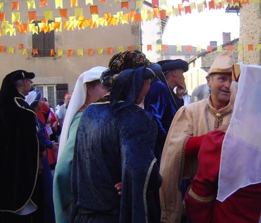 Local people perform dances in the streets in full mediaeval costume