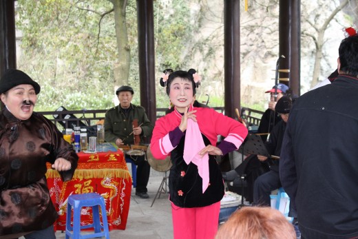 People from Western China perform traditional opera.
