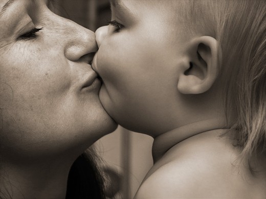 Mother Kissing Baby