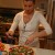 Katie putting toppings on her pizza Katie putting toppings on her pizza
